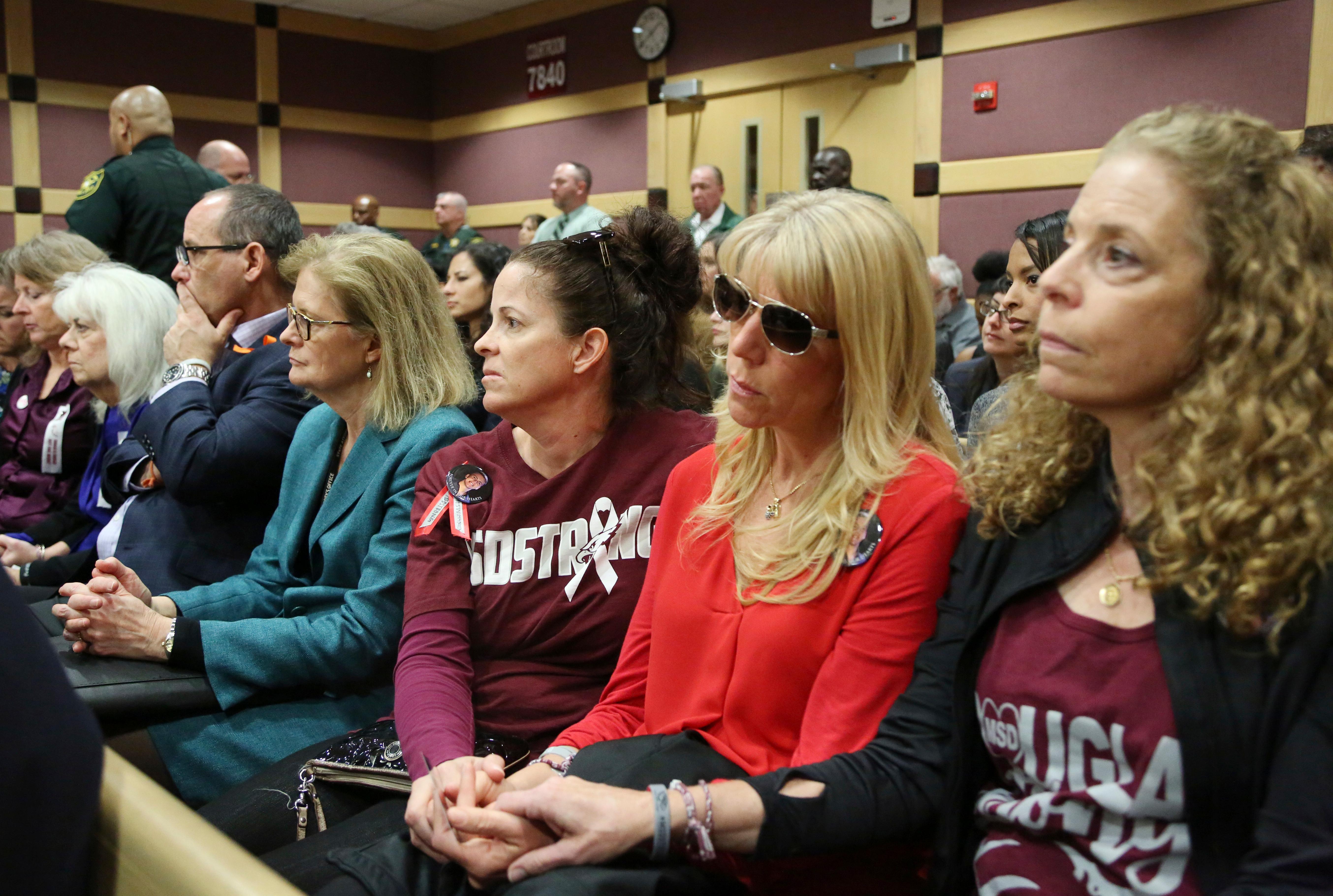 family and friends of victims watch as nikolas cruz is lead into